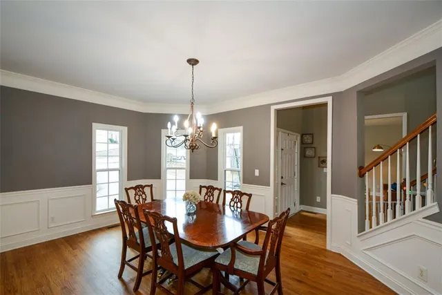 a view of a dining room with furniture window and wooden floor