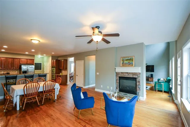 a front view of a house with a yard and potted plants