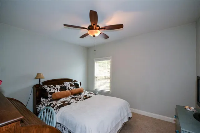 a living room with furniture window and a flat screen tv