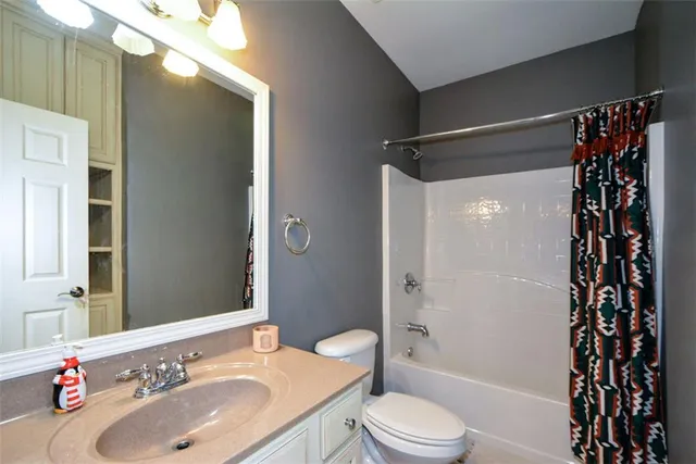 a view of entryway livingroom and hall with wooden floor