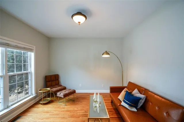 a spacious bathroom with a tub sink shower and a mirror