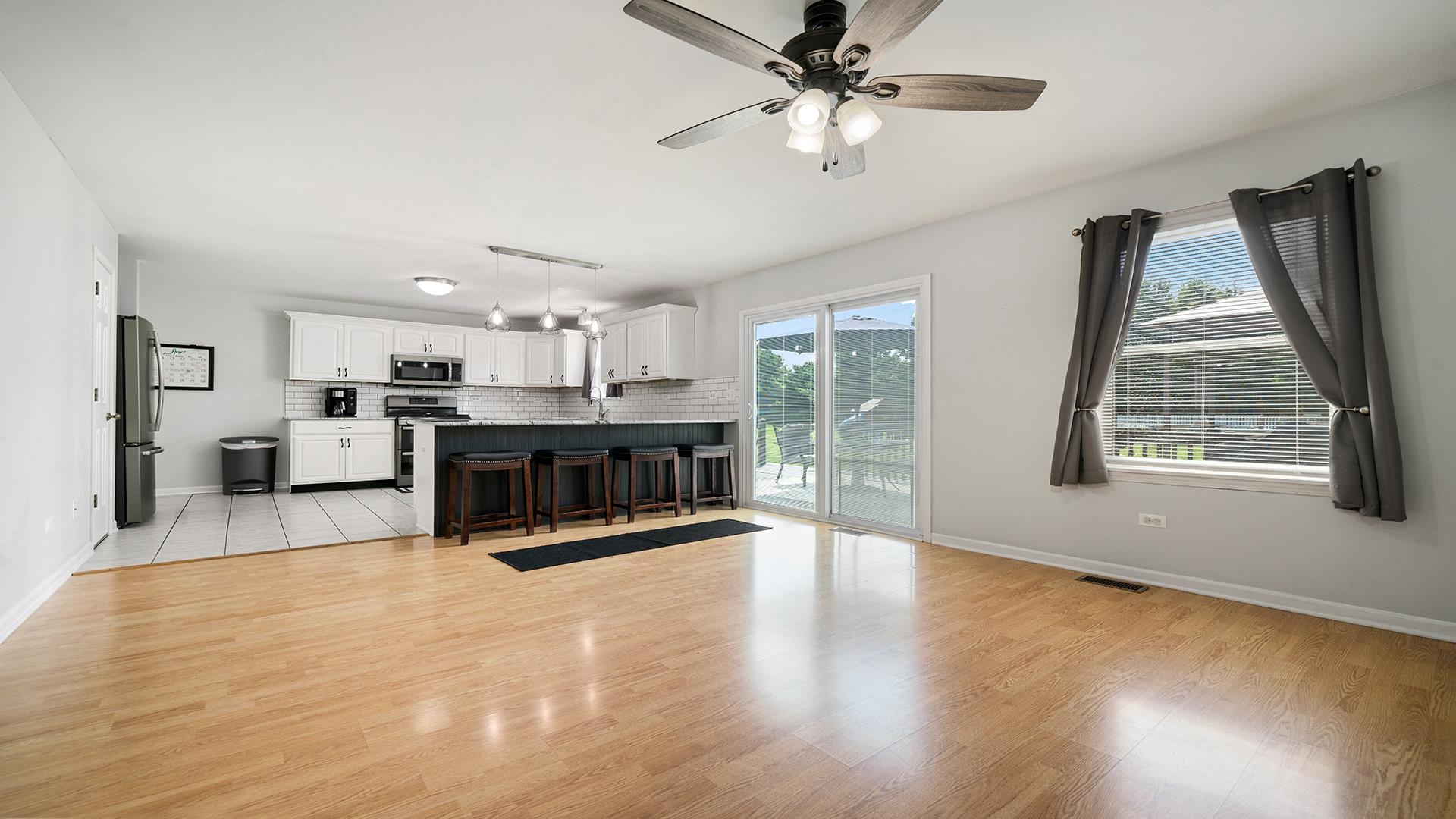 7903 Graf Road Harvard, IL 60033 - Photo 12 of 52 a view of a kitchen with furniture and a large window