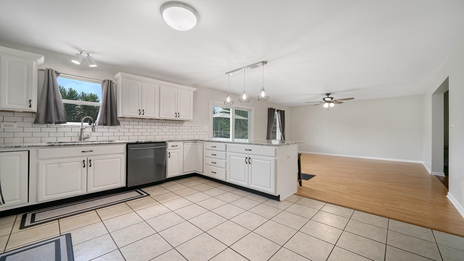 7903 Graf Road Harvard, IL 60033 - Photo 17 of 52 a kitchen with a sink cabinets and window