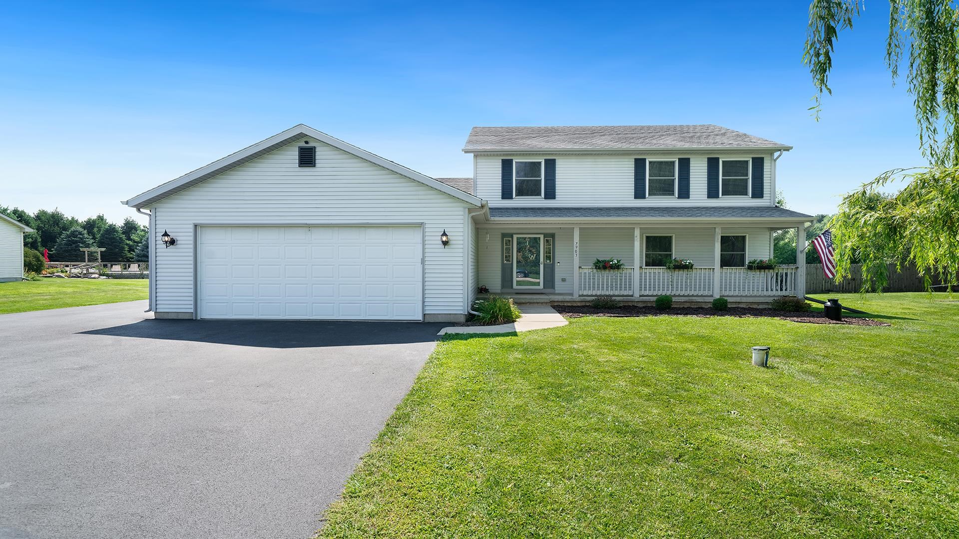 7903 Graf Road Harvard, IL 60033 - Photo 2 of 52 a front view of a house with a yard