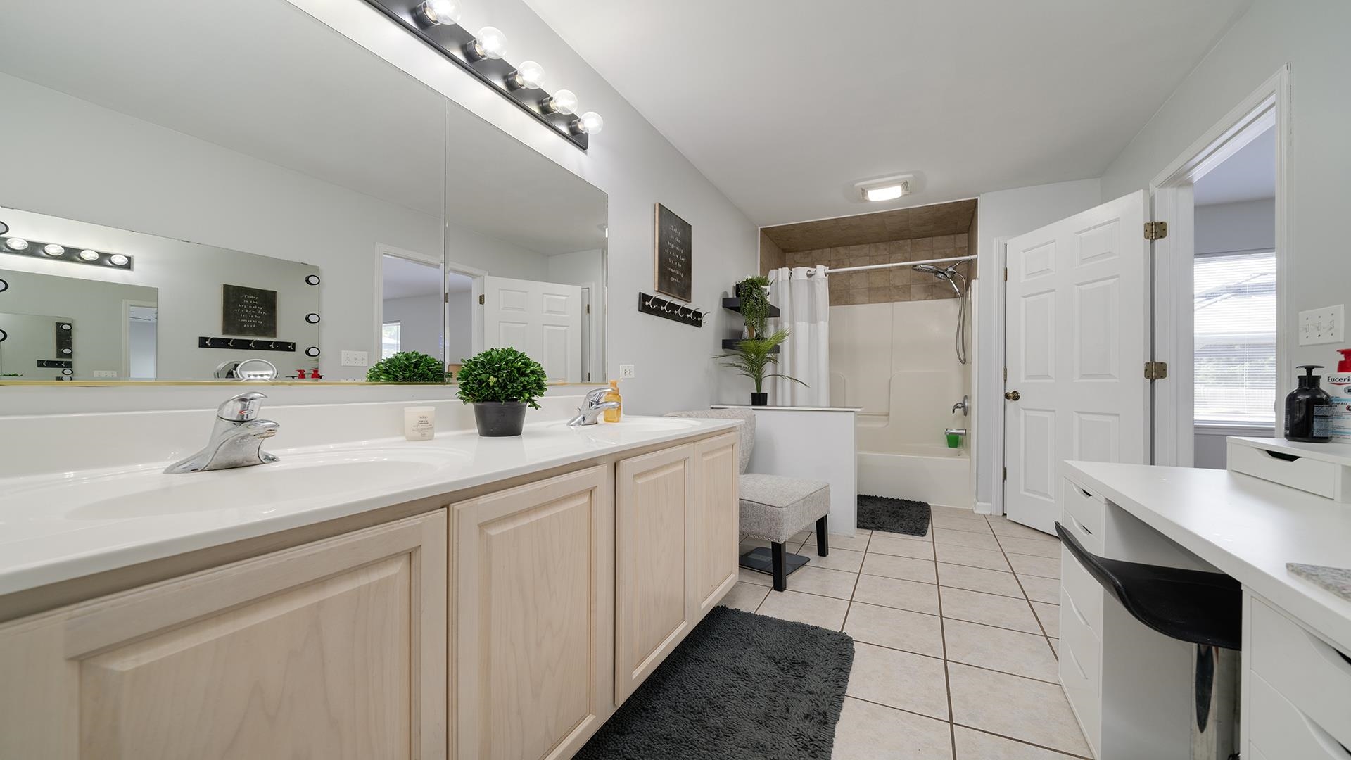 7903 Graf Road Harvard, IL 60033 - Photo 22 of 52 a spacious bathroom with a double vanity sink a mirror and a shower