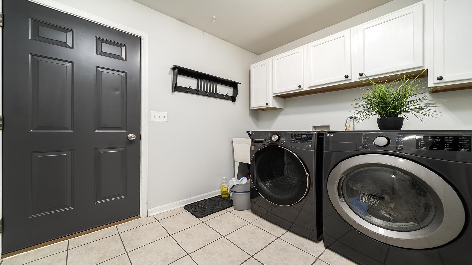 7903 Graf Road Harvard, IL 60033 - Photo 23 of 52 a utility room with sink dryer and washer