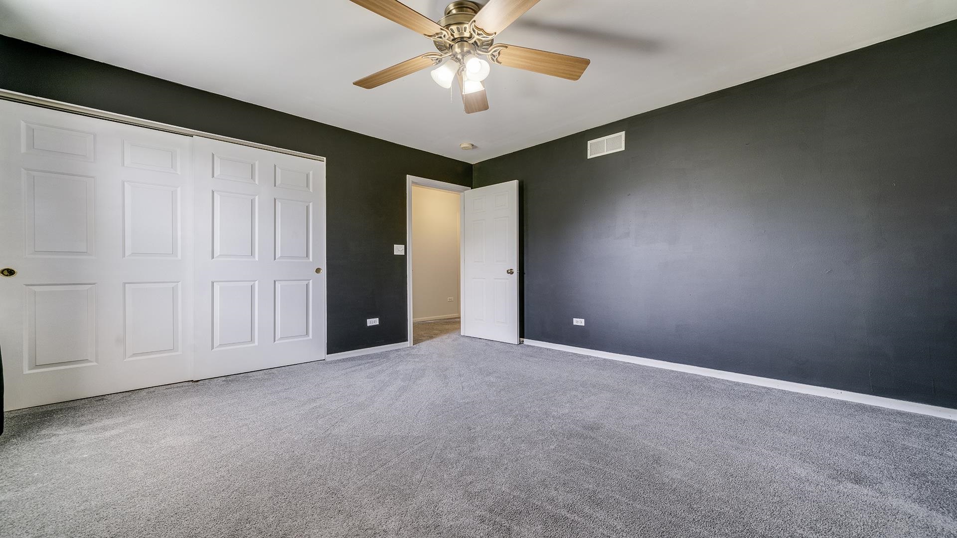 7903 Graf Road Harvard, IL 60033 - Photo 29 of 52 en empty room with windows and ceiling fan
