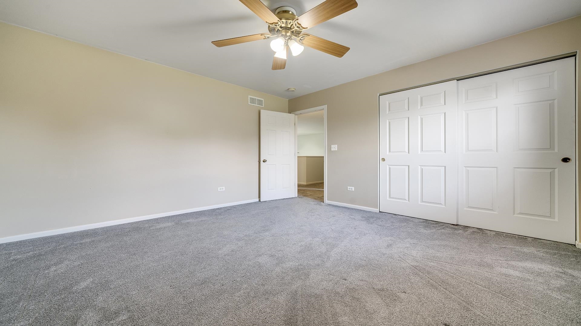 7903 Graf Road Harvard, IL 60033 - Photo 31 of 52 a view of an empty room and chandelier fan