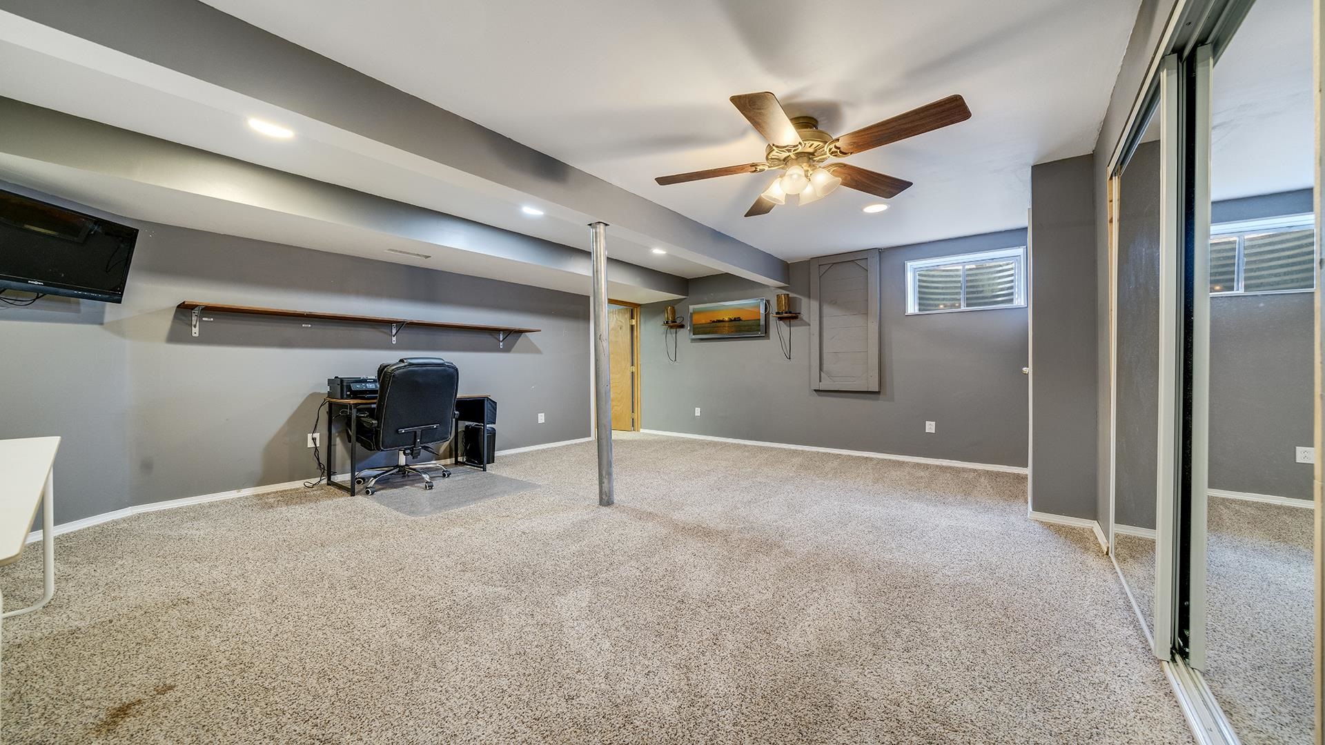 7903 Graf Road Harvard, IL 60033 - Photo 39 of 52 a view of a livingroom with furniture and a ceiling fan