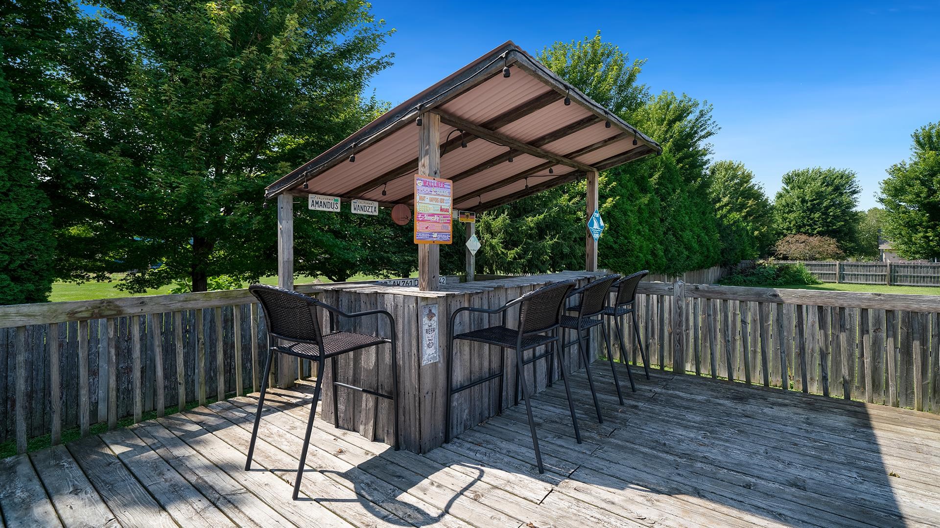 7903 Graf Road Harvard, IL 60033 - Photo 45 of 52 a view of patio with table and chairs with wooden floor and fence