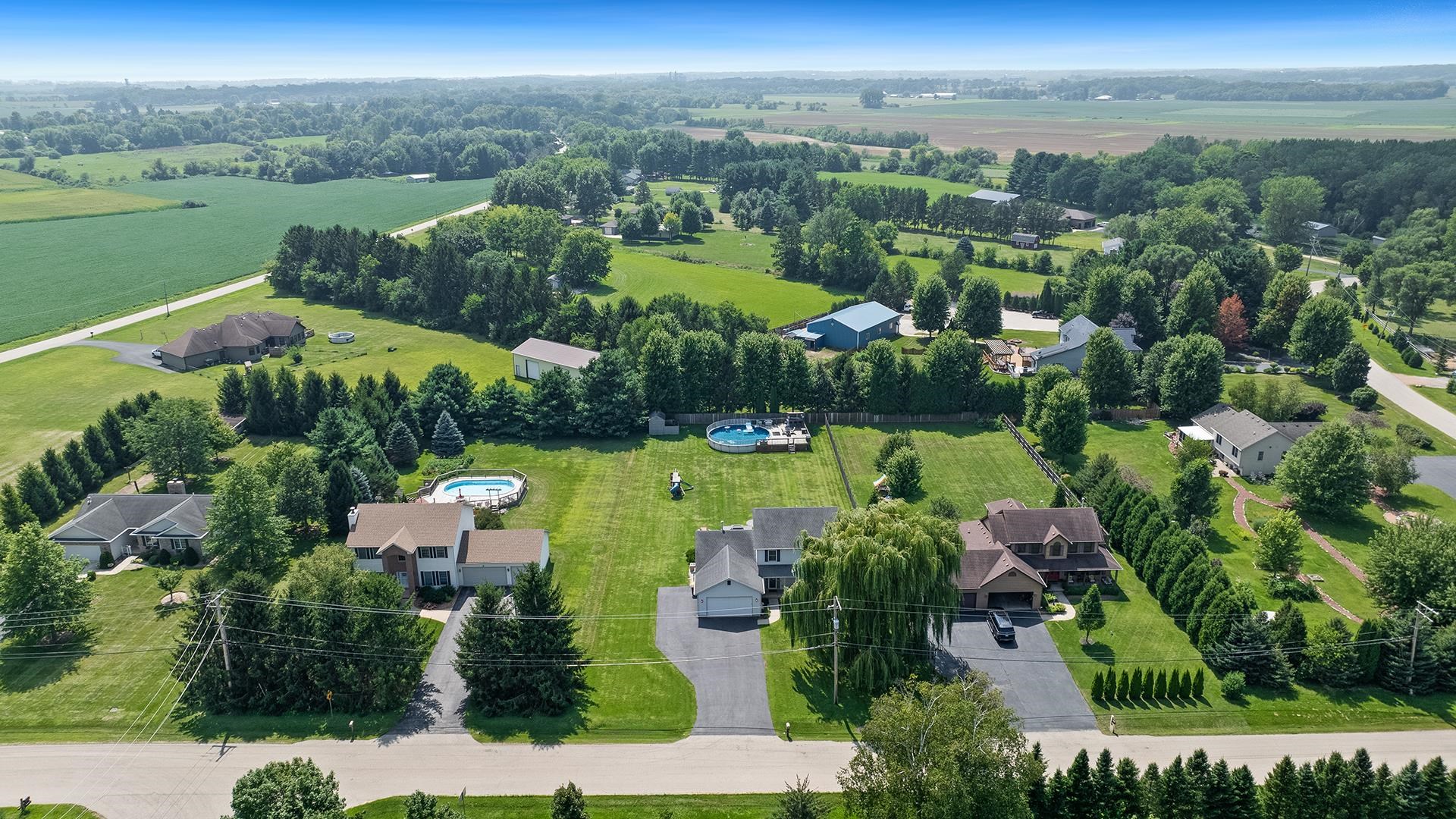 7903 Graf Road Harvard, IL 60033 - Photo 52 of 52 an aerial view of residential houses with outdoor space and river