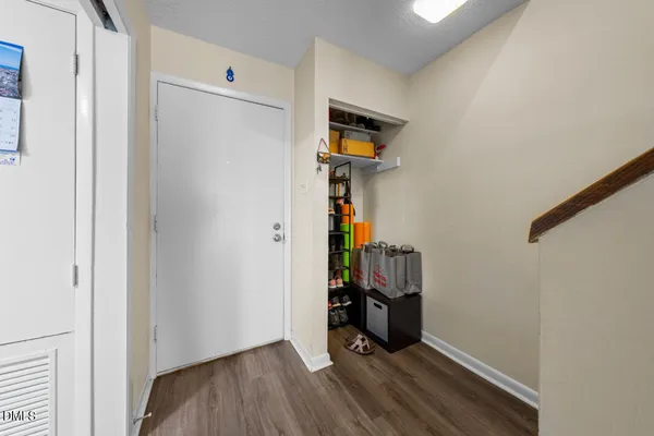 a view of a room with wooden floor and closet