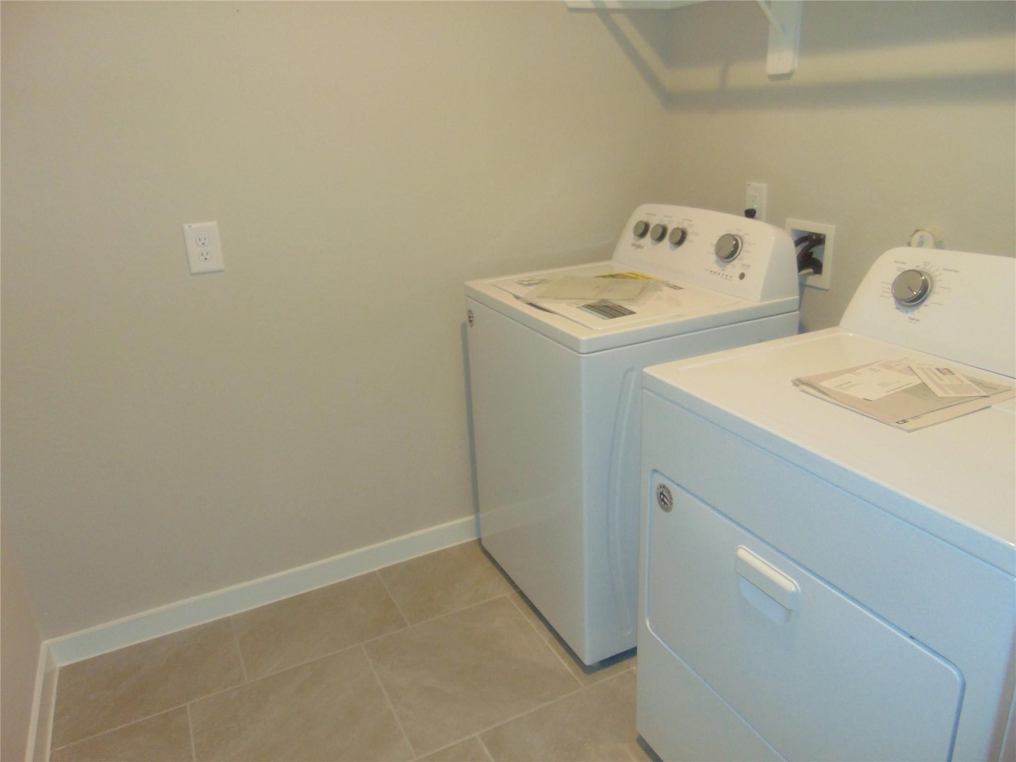 6918 Morales Way Richmond, TX 77469 - Photo 12 of 17 a utility room with dryer and washer