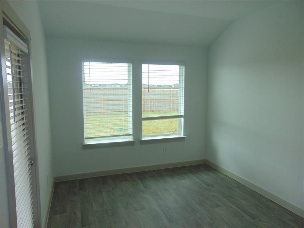 6918 Morales Way Richmond, TX 77469 - Photo 6 of 17 a view of an empty room with a window