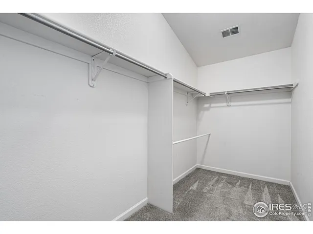 a view of an empty walk in closet