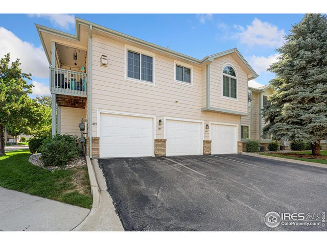 a view of a house with a yard and garage
