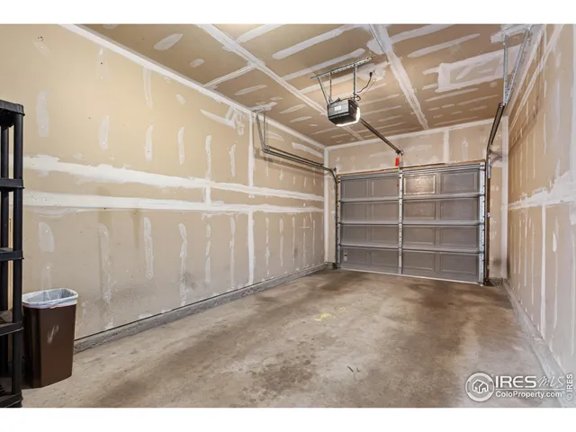 a view of an empty room with a staircase