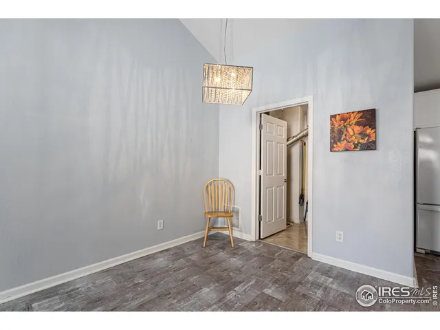 a view of a hallway with paintings on the wall