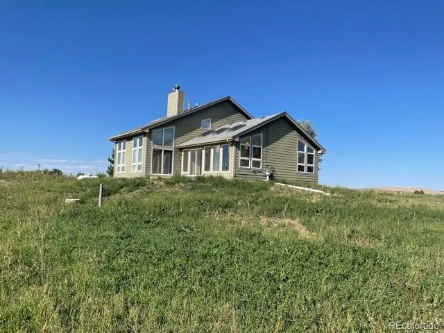 a view of a house with a big yard