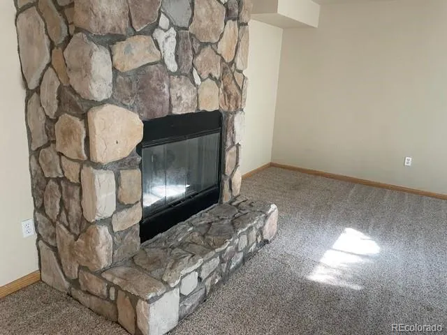 a room with fireplace and wooden floor
