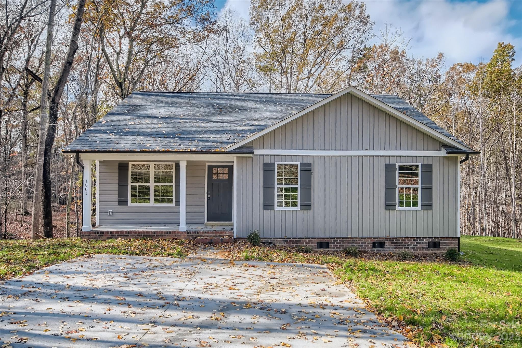 a house with a swimming pool in front of it