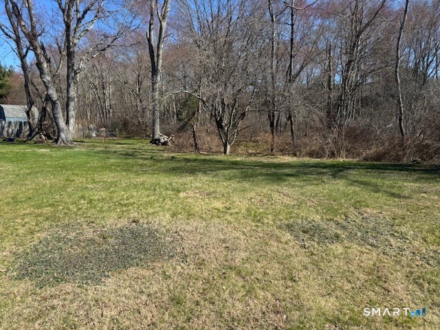 661 Riverside Drive Thompson, CT 06255 - Photo 11 of 11 a backyard of a house with lots of green space