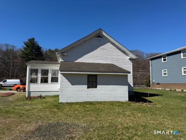 661 Riverside Drive Thompson, CT 06255 - Photo 2 of 11 a front view of a house with a yard