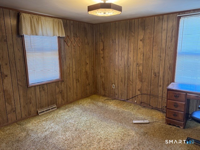 661 Riverside Drive Thompson, CT 06255 - Photo 7 of 11 a view of an empty room with wooden door