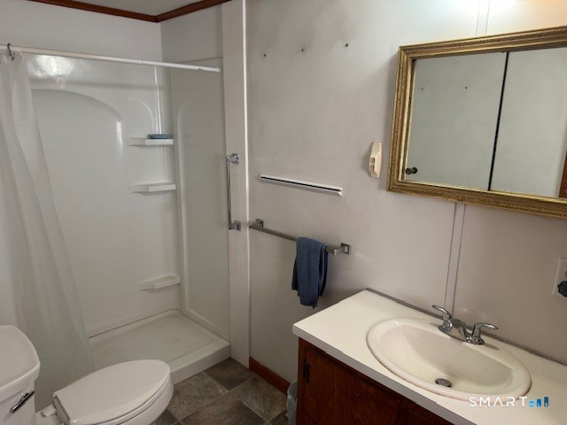 661 Riverside Drive Thompson, CT 06255 - Photo 8 of 11 a bathroom with a sink toilet and shower