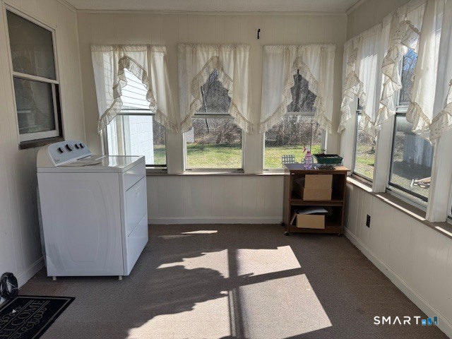 661 Riverside Drive Thompson, CT 06255 - Photo 9 of 11 a view of a room with a window and wooden floor