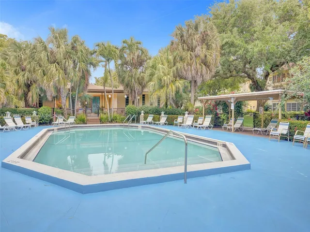 a view of a swimming pool with a patio