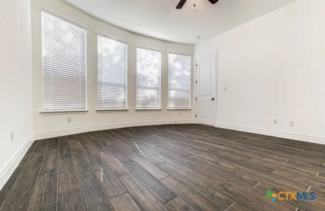 an aerial view of a house with outdoor space