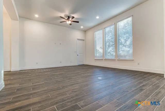 a kitchen with kitchen island granite countertop a sink appliances cabinets and counter space