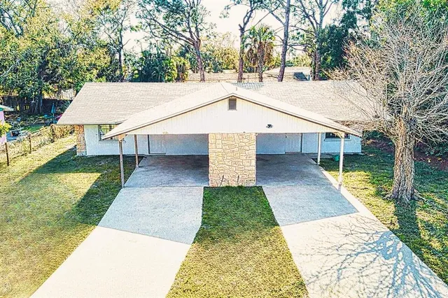 a aerial view of a house with a yard