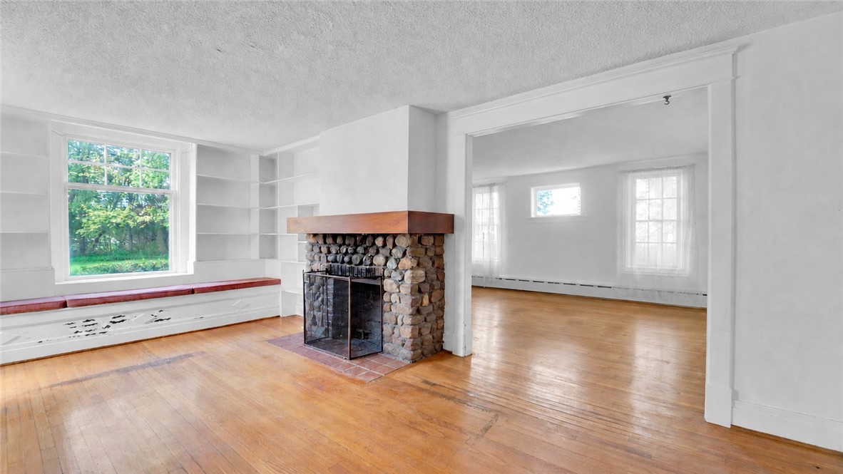 150 William Kidder Road Lancaster, NY 14086 - Photo 9 of 39 A wide-angle view of the Front Room (12' x 19') sh