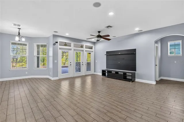 a kitchen with kitchen island granite countertop stainless steel appliances and wooden cabinets