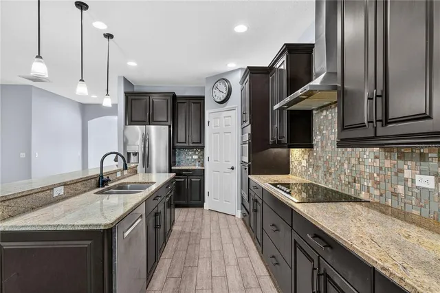 a view of a patio with a table chairs and a backyard