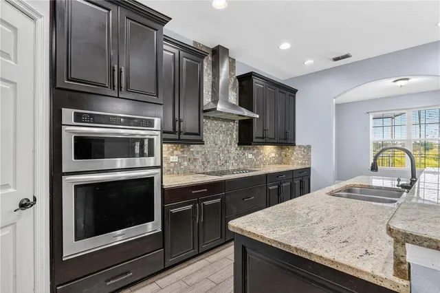 a view of a house with backyard porch and sitting area