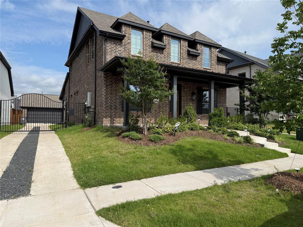 1840 Rosedale Avenue Van Alstyne, TX 75495 - Photo 3 of 24 Brick facade home featuring a covered front porch, dark-framed windows, and a concrete driveway with a central gravel strip