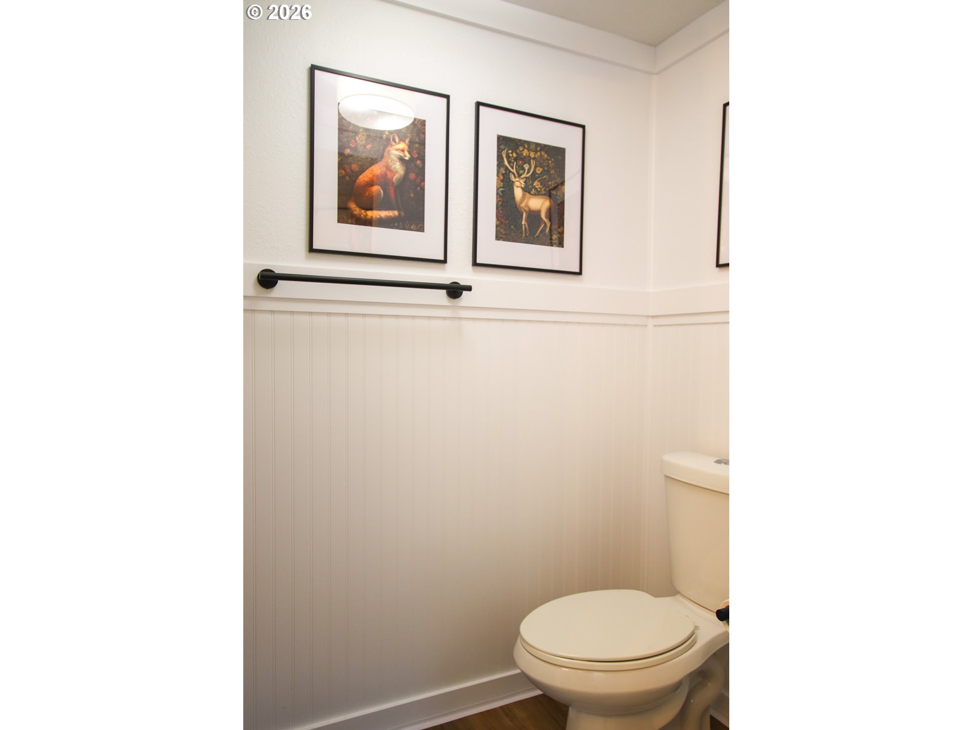 1431 Maple Street Florence, OR 97439 - Photo 32 of 43 a white toilet sitting next to a bathroom sink