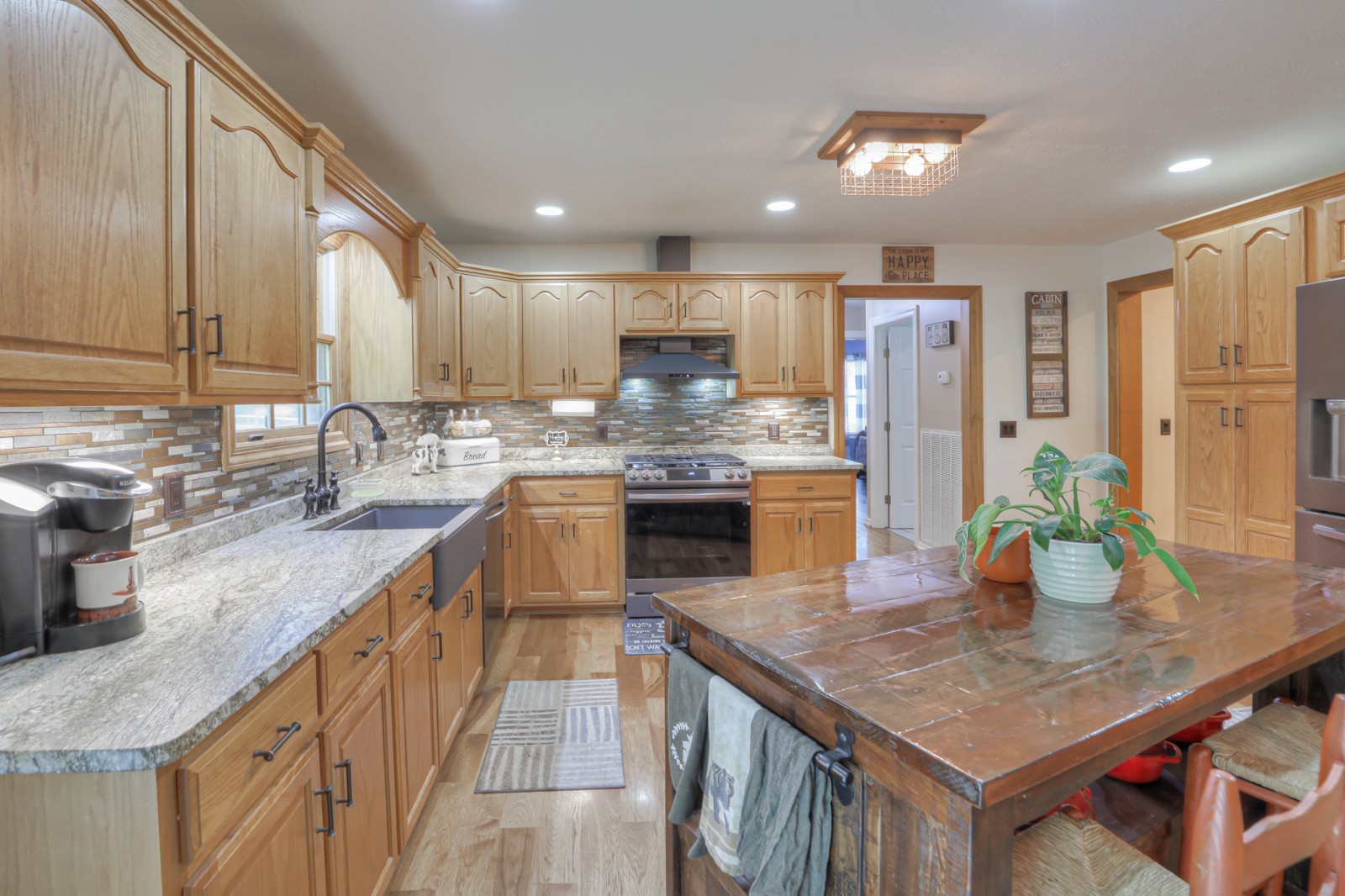 118 Robert Simmons Road Westmoreland, TN 37186 - Photo 13 of 82 a kitchen with stainless steel appliances granite countertop a kitchen island a stove a sink a refrigerator and blue cabinets