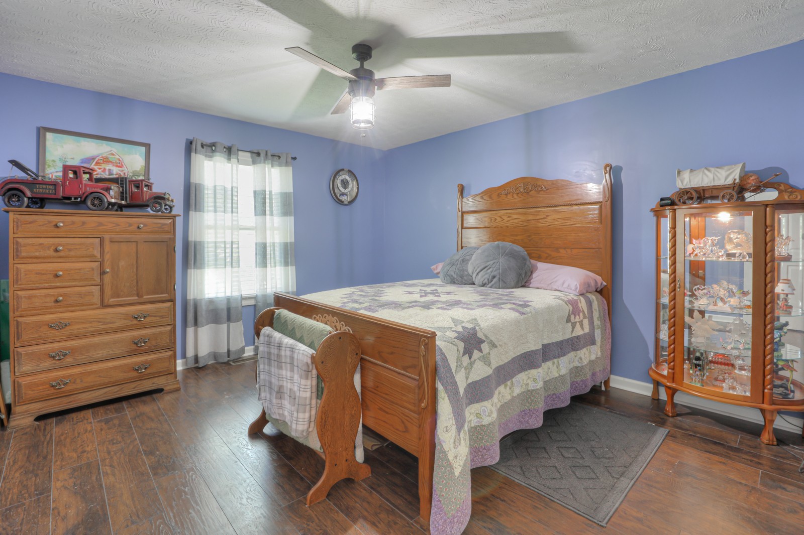 118 Robert Simmons Road Westmoreland, TN 37186 - Photo 27 of 82 a bedroom with a bed a dresser and next to a window