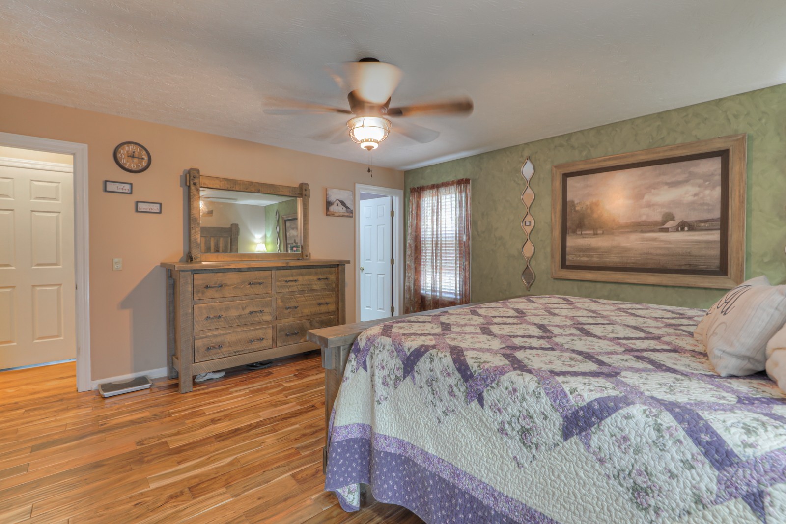 118 Robert Simmons Road Westmoreland, TN 37186 - Photo 28 of 82 a bedroom with a bed dresser and wooden floor