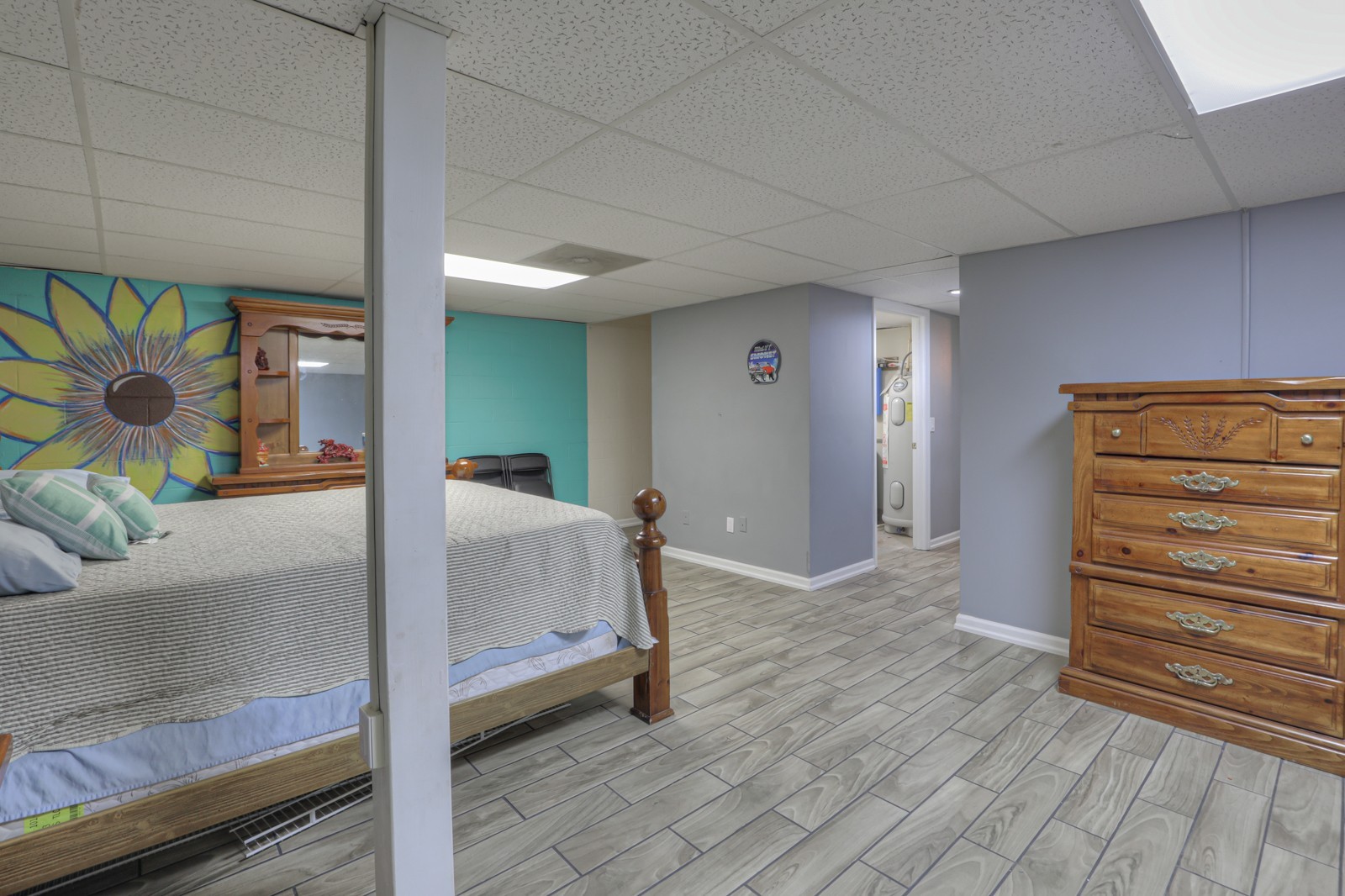118 Robert Simmons Road Westmoreland, TN 37186 - Photo 35 of 82 a bedroom with a bed and a painting on the wall