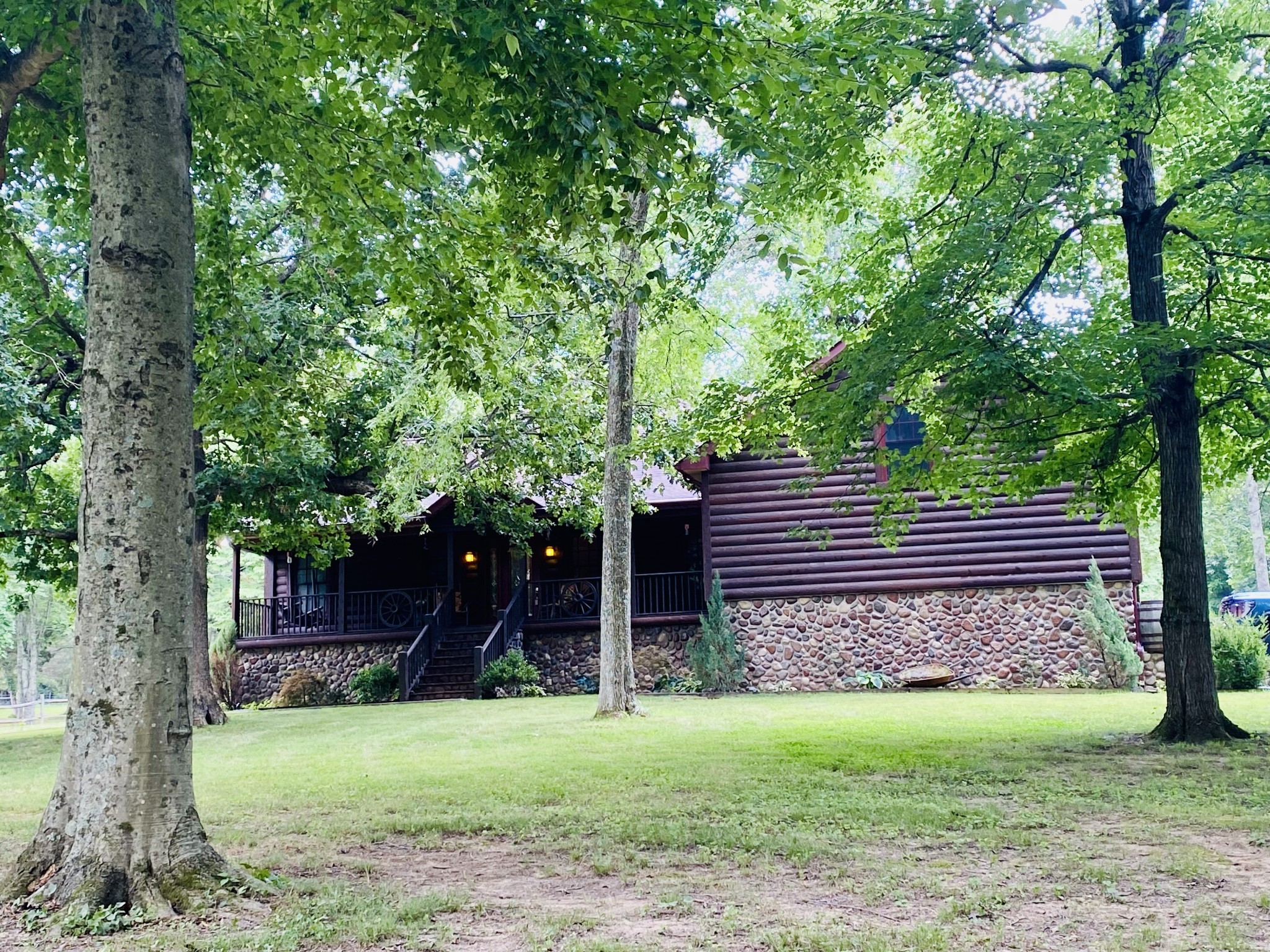 118 Robert Simmons Road Westmoreland, TN 37186 - Photo 81 of 82 a view of a backyard with a large tree and wooden fence