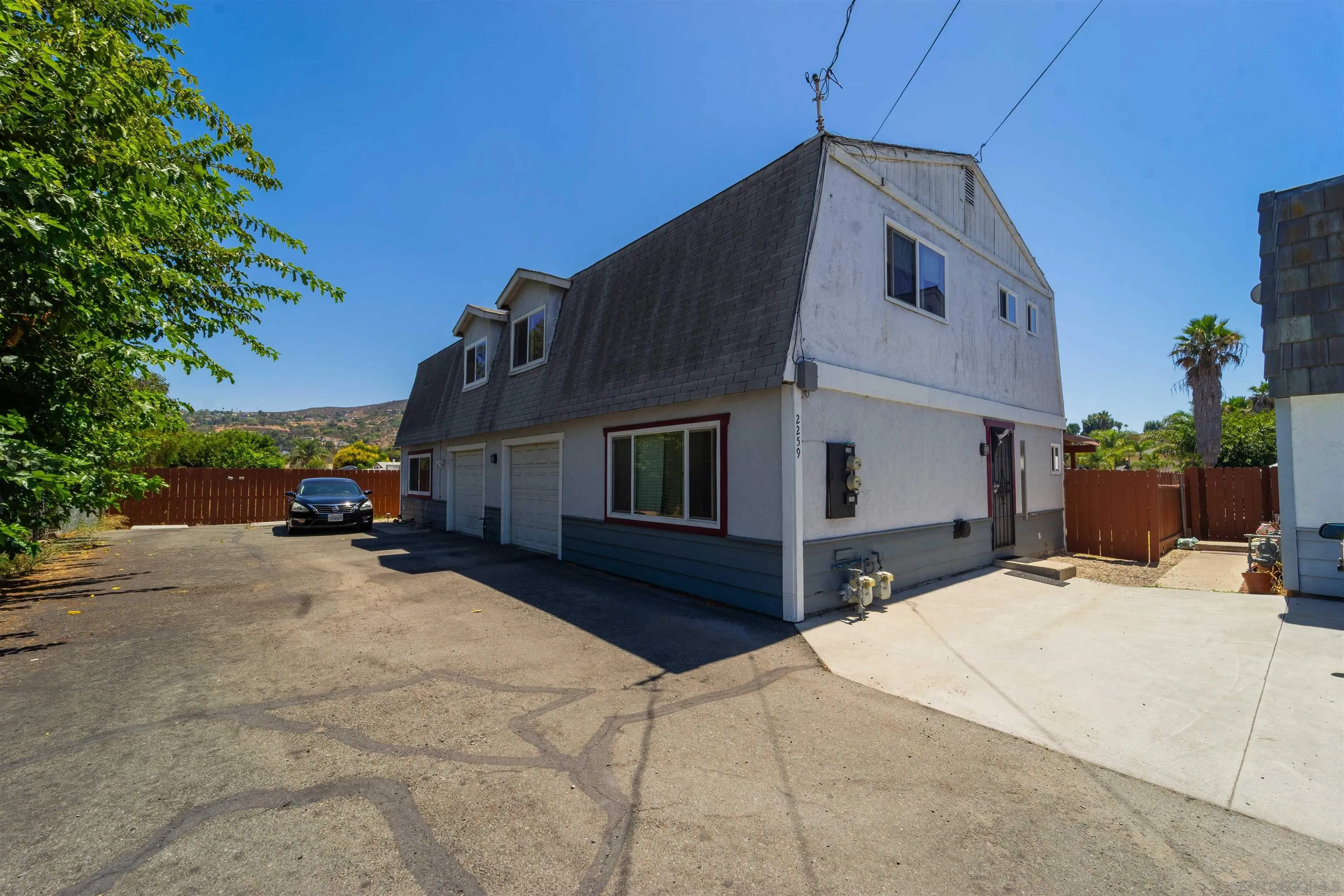 2259-61 Tyler Court Spring Valley, CA 91977 - Photo 3 of 7 a view of a house with a patio