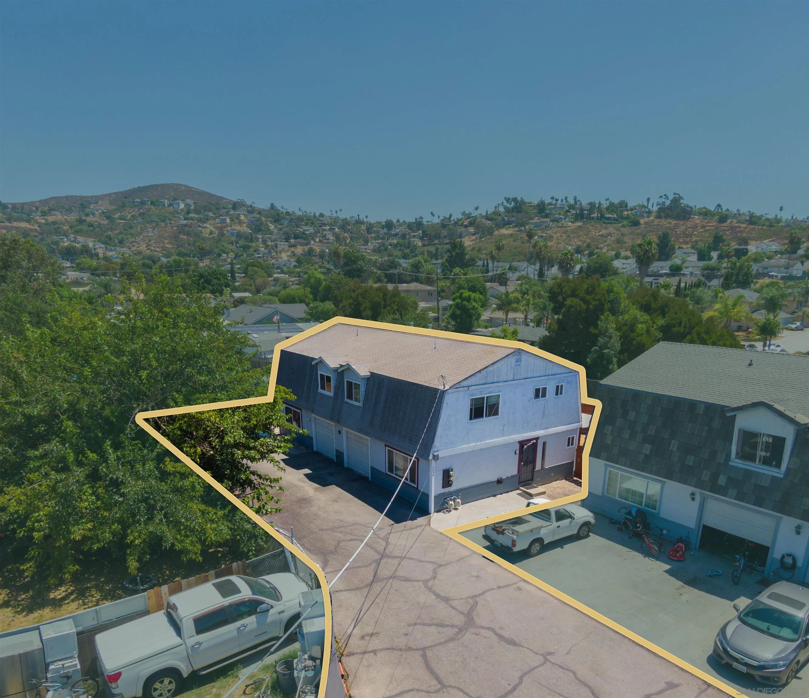 2259-61 Tyler Court Spring Valley, CA 91977 - Photo 5 of 7 a aerial view of a house with a yard