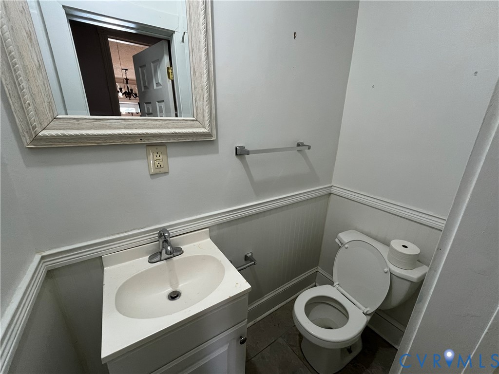 2316 R Street Richmond, VA 23223 - Photo 11 of 18 Bathroom with vanity and a wainscoted wall