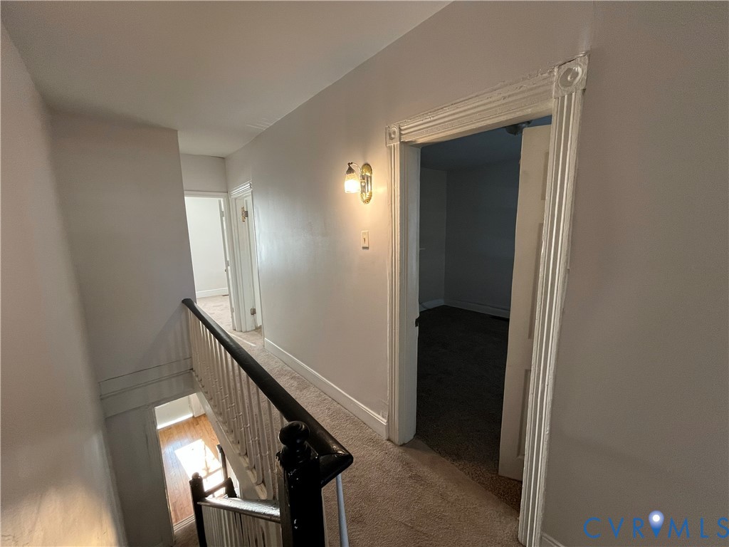 2316 R Street Richmond, VA 23223 - Photo 13 of 18 Corridor with an upstairs landing and light colore