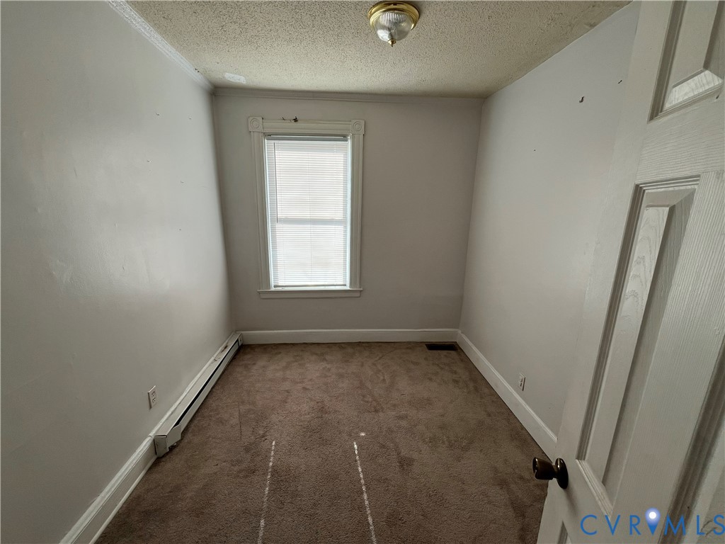 2316 R Street Richmond, VA 23223 - Photo 16 of 18 Unfurnished room featuring baseboard heating, a te